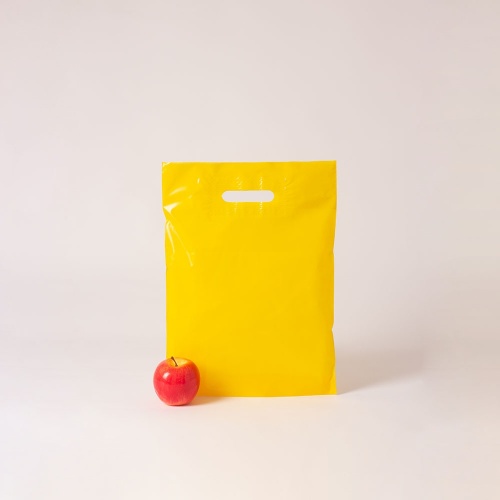 Полиэтиленовые пакеты 30х40х3см, цвет - желтый, материал - полиэтилен, ламинация - без ламинации, ручки - прорубные, фото 1 (вид спереди)