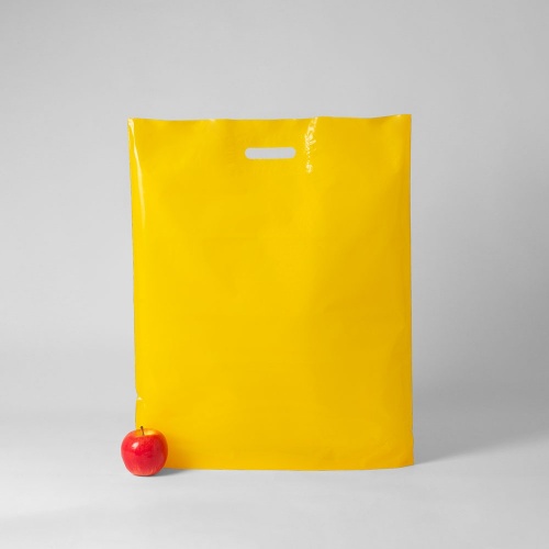 Полиэтиленовые пакеты 50х60х4см, цвет - желтый, материал - полиэтилен, ламинация - без ламинации, ручки - прорубные, фото 1 (вид спереди)
